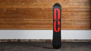 DC Supernatant snowboard leaned against a wall.